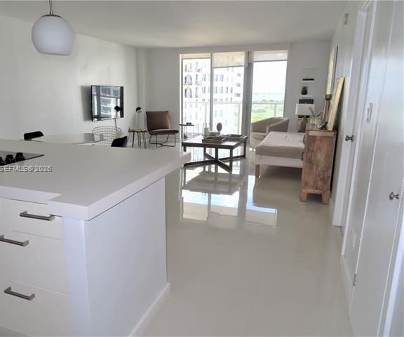 Remodeled Mid-Beach 1BR With Bay Views